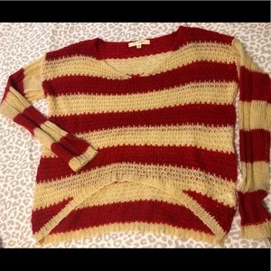 Red and cream knitted sweater.